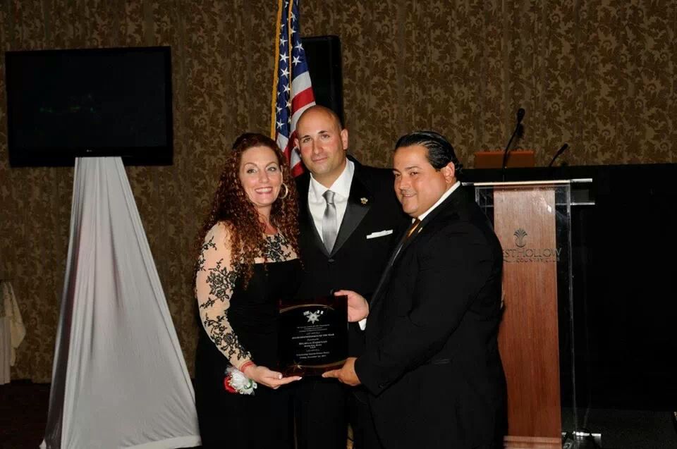 The Bail Bond Queen® receiving the award for "Businessperson of the year" from the Nassau County Sheriff's Department 